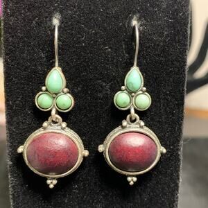 Silver toned Cabochon style ornate carved earrings